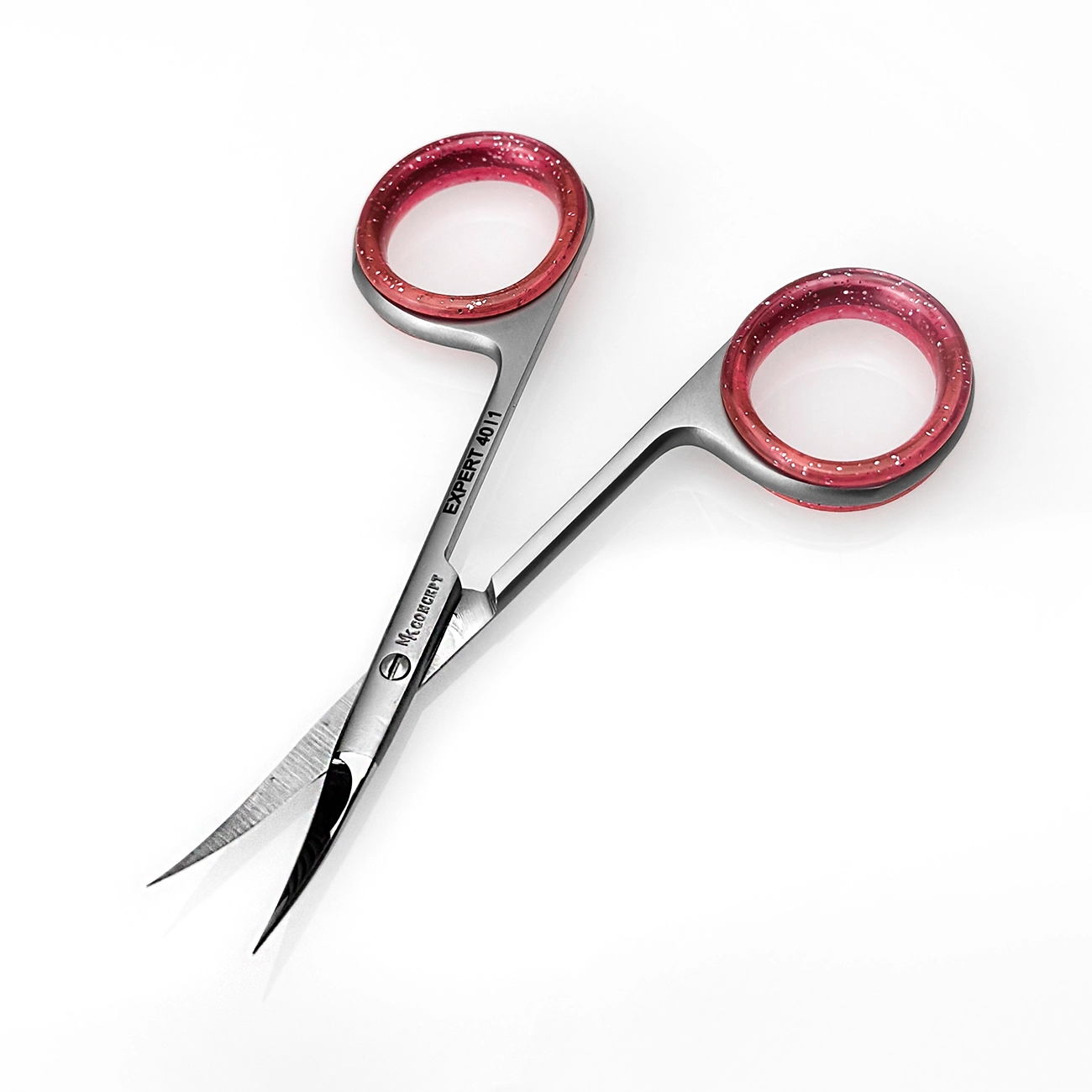Close-up of MK Concept curved cuticle scissors with pink finger cushion grip